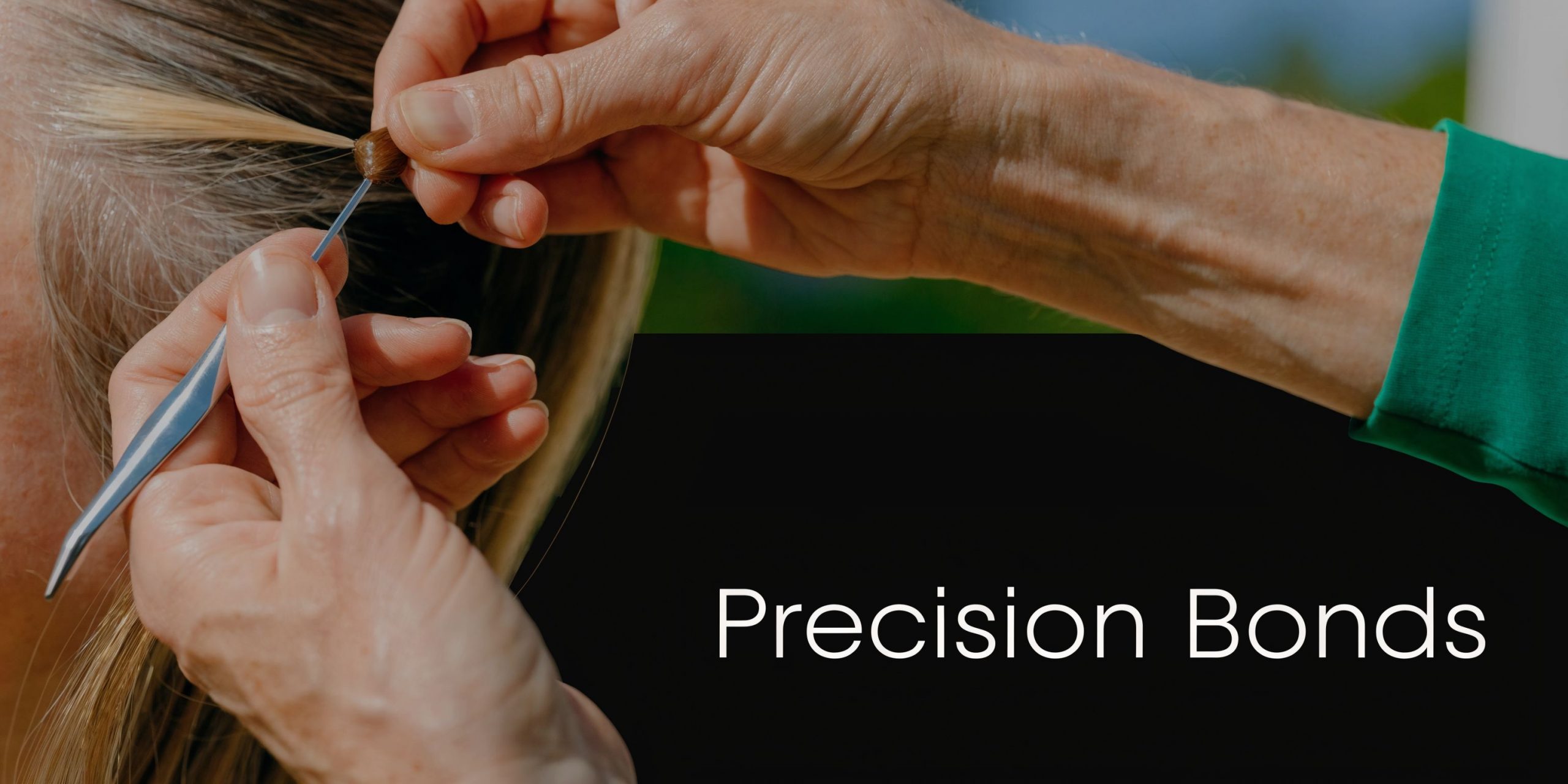 A professional hairstylist carefully applying a precision bond hair extension to a client's natural blonde hair strands.