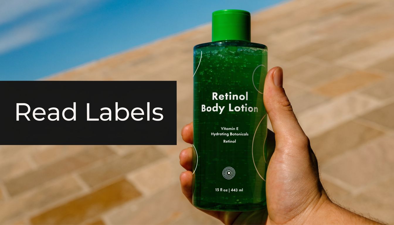 A hand holding a green bottle of Retinol Body Lotion outdoors against a stone background.